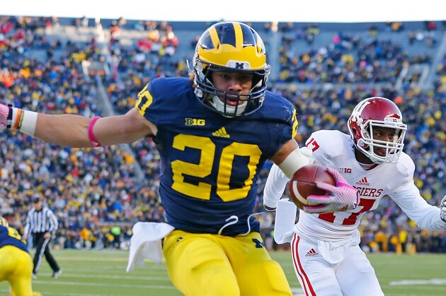 ANN ARBOR, MI - NOVEMBER 1: Drake Johnson #20 of the Michigan Wolverines scores during the third quarter of the game against Indiana Hoosiers at Michigan Stadium on November 1 , 2014 in Ann Arbor, Michigan. The Wolverines defeated the Hoosiers 34-10. (Photo by Leon Halip/Getty Images)
