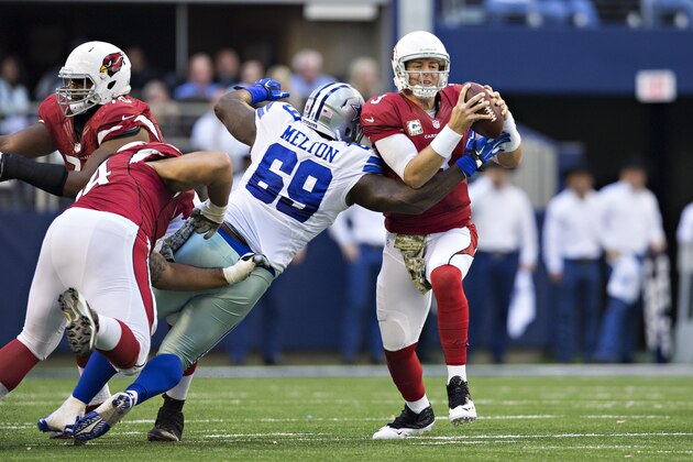 ARLINGTON, TX - NOVEMBER 2:  Henry Melton #69 of the Dallas Cowboys hits Carson Palmer #3 of the Arizona Cardinals during the first quarter at AT&T Stadium on November 2, 2014 in Arlington, Texas.  (Photo by Wesley Hitt/Getty Images)