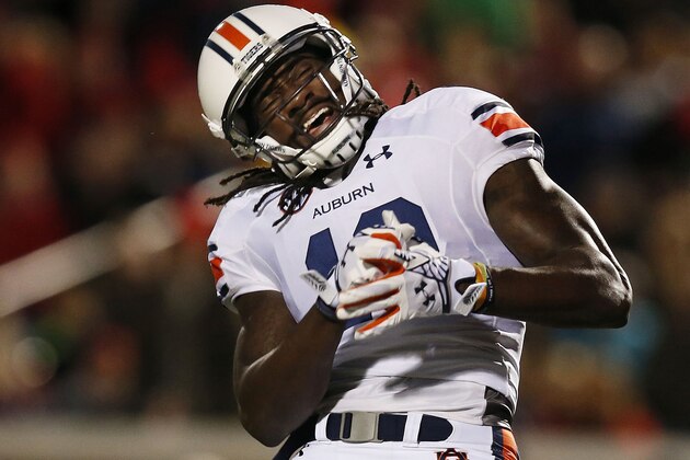 Auburn wide receiver Sammie Coates reacts after an incomplete pass from quarterback Nick Marshall during the first half of an NCAA college football game against Mississippi, Saturday, Nov. 1, 2014, in Oxford, Miss. (AP Photo/Brynn Anderson)