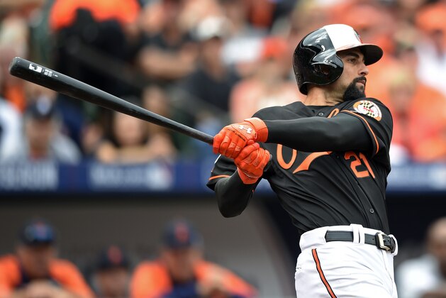 Baltimore Orioles' Nick Markakis watches his two-run home run in the third inning of Game 2 in baseball's AL Division Series against the Detroit Tigers in Baltimore, Friday, Oct. 3, 2014. (AP Photo/Nick Wass)