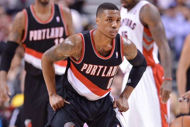 Nov 17, 2013; Toronto, Ontario, CAN; Portland Trail Blazers point guard Damian Lillard (0) sets up in defense during the second quarter of a game against the Toronto Raptors at the Air Canada Centre. Portland won the game 118-110. Mandatory Credit: Mark Konezny-USA TODAY Sports