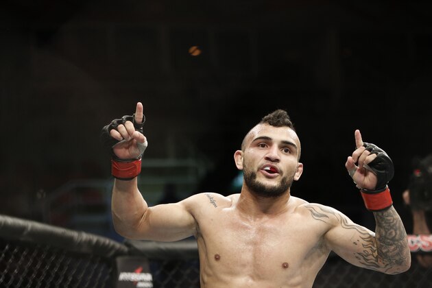 John Lineker, from Brazil, celebrates after defeating countryman Jose Maria, during their UFC 163 mixed martial arts Flyweight bout in Rio de Janeiro, Brazil, Saturday, Aug. 3, 2013. (AP Photo/Felipe Dana)
