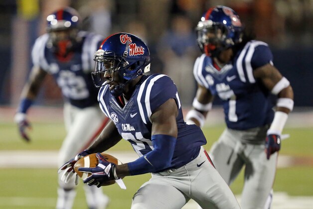 Mississippi defensive back Senquez Golson (21) runs with an interception of a Tennessee pass during the first half of an NCAA college football game in Oxford, Miss., Saturday, Oct. 18, 2014. No. 3 Mississippi won 34-3. (AP Photo/Rogelio V. Solis)