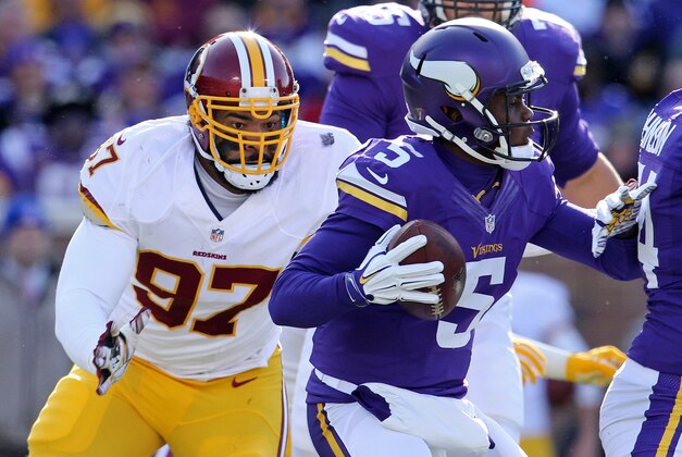Nov 2, 2014; Minneapolis, MN, USA; Minnesota Vikings quarterback Teddy Bridgewater (5) is sacked by Washington Redskins defensive end Jason Hatcher (97) during the second quarter at TCF Bank Stadium. Mandatory Credit: Brace Hemmelgarn-USA TODAY Sports
