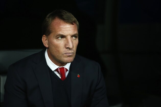 Liverpool's head coach Brendan Rodgers takes his seat before a Group B Champions League soccer match between Real Madrid and Liverpool at the Santiago Bernabeu stadium in Madrid, Spain, Tuesday Nov. 4, 2014. (AP Photo/Andres Kudacki)