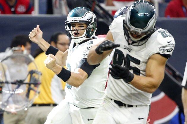 Philadelphia Eagles quarterback Mark Sanchez, left, celebrates along side teammate James Casey after throwing an 8-yard touchdown pass to wide receiver Jeremy Maclin during the fourth quarter of an NFL football game against the Houston Texans, Sunday, Nov. 2, 2014, in Houston. (AP Photo/Tony Gutierrez)