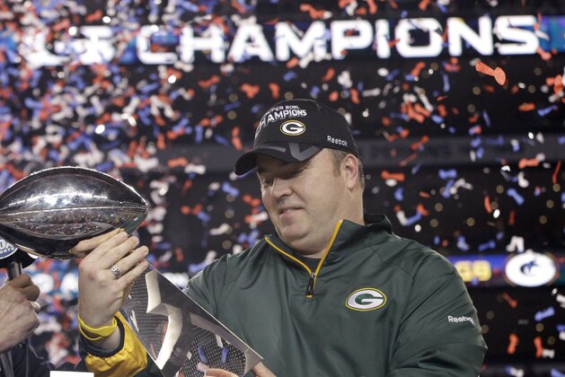 Green Bay Packers head coach Mike McCarthy holds the Vince Lombardi Trophy after beating the Pittsburgh Steelers 31-25 in the NFL Super Bowl XLV football game Sunday, Feb. 6, 2011, in Arlington, Texas. (AP Photo/David J. Phillip)