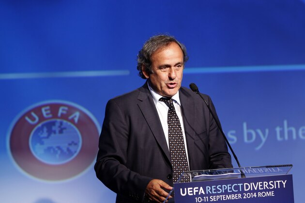 UEFA President Michel Platini speaks during the opening session of UEFA's Respect and Diversity conference against discrimination in European soccer, in Rome, Wednesday, Sept. 10, 2014. Platini has promised a ruling from the organization's disciplinary body over an alleged racist comment by the Italian football federation's new leader. Carlo Tavecchio, a long-standing executive in Italian football, was elected president last month despite causing a stir over a reference to bananas when discussing the presence of foreign players in Italy. (AP Photo/Riccardo De Luca)