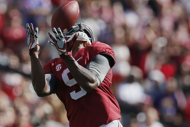 Alabama wide receiver Amari Cooper (9) catches the ball and runs for a touchdown against Florida in the first half of an NCAA college football game on Saturday, Sept. 20, 2014, in Tuscaloosa, Ala. (AP Photo/Brynn Anderson)