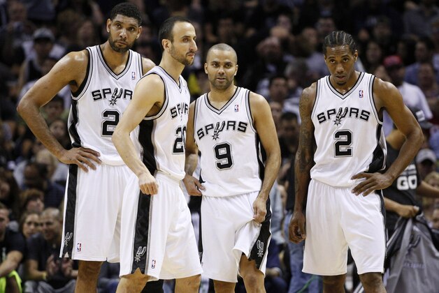 May 14, 2014; San Antonio, TX, USA; San Antonio Spurs players (from left) Tim Duncan, and Manu Ginobili, and Tony Parker, and Kawhi Leonard after a timeout against the Portland Trail Blazers in game five of the second round of the 2014 NBA Playoffs at AT&T Center. Mandatory Credit: Soobum Im-USA TODAY Sports