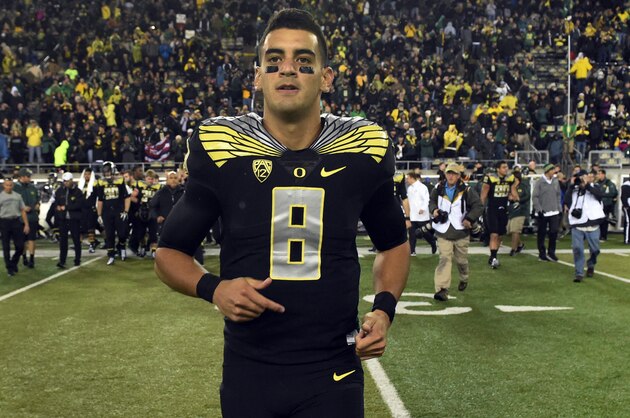 EUGENE, OR - NOVEMBER 1: Quarterback Marcus Mariota #8 of the Oregon Ducks runs out onto the field after the game against the Stanford Cardinal at Autzen Stadium on November 1, 2014 in Eugene, Oregon. Oregon won the game 45-16.(Photo by Steve Dykes/Getty Images)