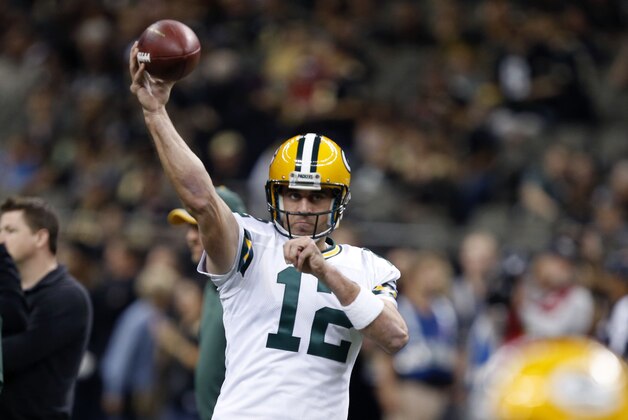 Green Bay Packers quarterback Aaron Rodgers (12) warms up before an NFL football game against the New Orleans Saints in New Orleans, Sunday, Oct. 26, 2014. (AP Photo/Rogelio Solis)