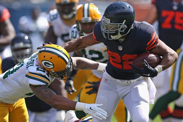 CHICAGO, IL - SEPTEMBER 28:  Matt Forte #22 of the Chicago Bears tries to avoid a tackle by Ha Ha Clinton-Dix #21 of the Green Bay Packers during the first quarter at Soldier Field on September 28, 2014 in Chicago, Illinois. The Packers defeated the Bears 38-17. (Photo by Jonathan Daniel/Getty Images)