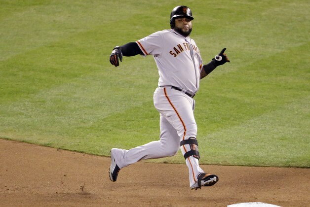 San Francisco Giants' Pablo Sandoval runs to second for a double during the fourth inning of Game 2 of baseball's World Series against the Kansas City Royals Wednesday, Oct. 22, 2014, in Kansas City, Mo. (AP Photo/Charlie Riedel)