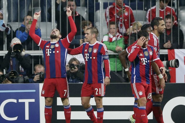 Bayern's Franck Ribery, left, celebrates his side's opening goal during the Champions League Group E soccer match between FC Bayern Munich and AS Roma at Allianz Arena in Munich, southern Germany, Wednesday Nov. 5, 2014. (AP Photo/Matthias Schrader)