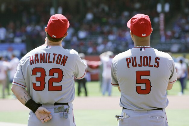Apr 5, 2013; Arlington, TX, USA; Los Angeles Angels right fielder Josh Hamilton (32) and first baseman Albert Pujols (5) on the field before the game against the Texas Rangers at Rangers Ballpark in Arlington. Mandatory Credit: Tim Heitman-USA TODAY Sports