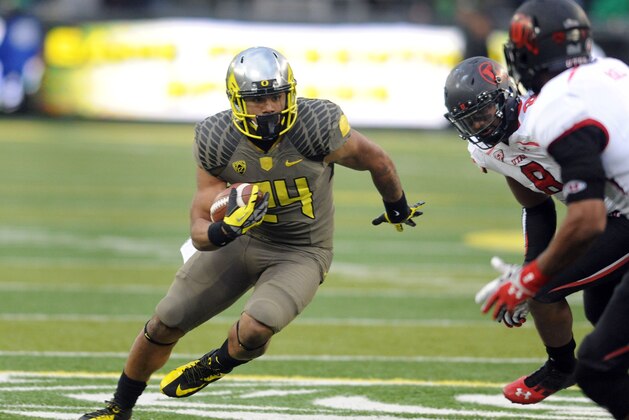 EUGENE, OR - NOVEMBER 16: Running back Thomas Tyner #24 of the Oregon Ducks runs with the ball during the fourth quarter of the game against the Utah Utes at Autzen Stadium on November 16, 2013 in Eugene, Oregon. (Photo by Steve Dykes/Getty Images)