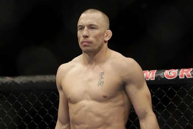 Georges St. Pierre, of Canada, waits to begin a UFC 167 mixed martial arts championship welterweight bout against Johny Hendricks on Saturday, Nov. 16, 2013, in Las Vegas. St. Pierre won by split decision. (AP Photo/Isaac Brekken)