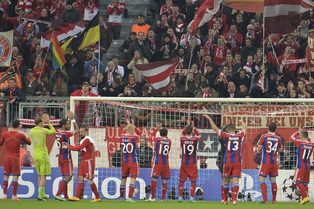 Munich teammates celebrate with supporters after winning the Champions League group E soccer match between Bayern Munich and Roma in Munich, Germany, on Wednesday, Nov. 05, 2014. Munich won by 2-0. (AP Photo/Kerstin Joensson)