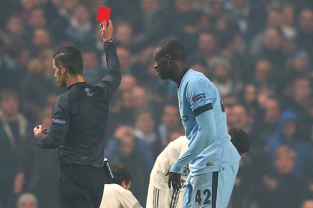 MANCHESTER, ENGLAND - NOVEMBER 05:  Yaya Toure of Manchester City is shown a red card by Referee Tasos Sidriopoulos during the UEFA Champions League Group E match between Manchester City and CSKA Moscow on November 5, 2014 in Manchester, United Kingdom.  (Photo by Alex Livesey/Getty Images)