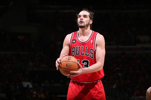 WASHINGTON, DC - APRIL 25: Joakim Noah #13 of the Chicago Bulls shoots a free throw in Game Three of the Eastern Conference Quarterfinals during the 2014 NBA Playoffs against the Washington Wizards at the Verizon Center on April 25, 2014 in Washington, DC. NOTE TO USER: User expressly acknowledges and agrees that, by downloading and or using this photograph, User is consenting to the terms and conditions of the Getty Images License Agreement. (Photo by Ned Dishman/Getty Images)