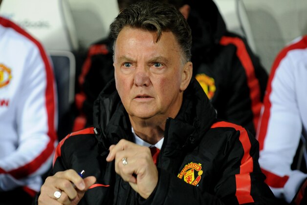 Manchester United manager Louis van Gaal watches in the dug out during the English Premier League soccer match between West Bromwich Albion and Manchester United at the Hawthorns, Birmingham, England, Monday, Oct. 20, 2014. (AP Photo/Rui Vieira)
