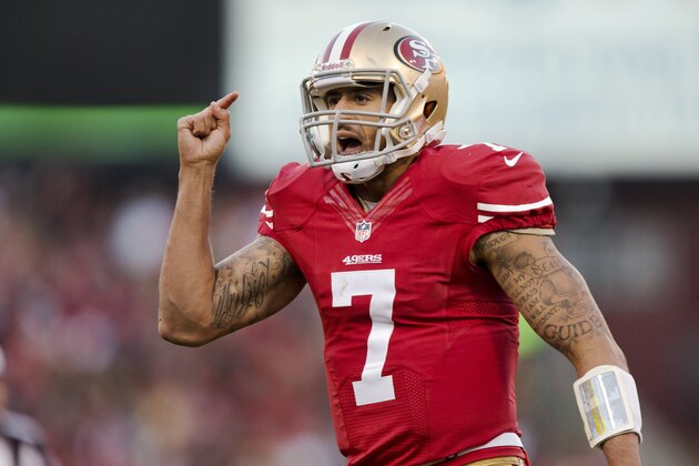 SAN FRANCISCO, CA - DECEMBER 08:  Quarterback Colin Kaepernick #7 of the San Francisco 49ers congratulates running back Frank Gore #21 of the San Francisco 49ers on a play against the Seattle Seahawks late in the fourth quarter on December 8, 2013 at Candlestick Park in San Francisco, California.  The play set up the winning field goal in the 49ers 19-17 win.  (Photo by Brian Bahr/Getty Images)
