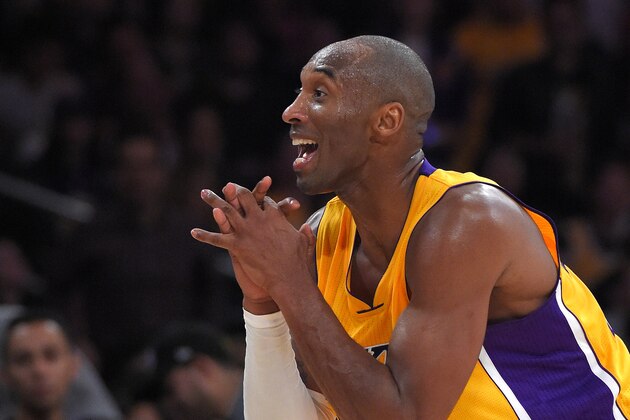 Los Angeles Lakers guard Kobe Bryant pleads with referee Marc Davis after he was called for traveling during the second half of an NBA basketball game against the Phoenix Suns, Tuesday, Nov. 4, 2014, in Los Angeles. The Suns won 112-106. (AP Photo/Mark J. Terrill)