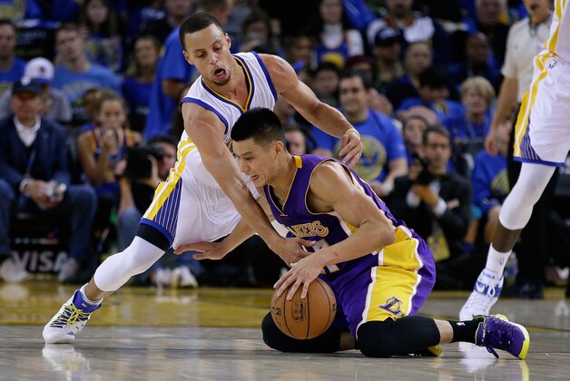 OAKLAND, CA - NOVEMBER 01:  Stephen Curry #30 of the Golden State Warriors tries to steal the ball from Jeremy Lin #17 of the Los Angeles Lakers at ORACLE Arena on November 1, 2014 in Oakland, California. NOTE TO USER: User expressly acknowledges and agrees that, by downloading and or using this photograph, User is consenting to the terms and conditions of the Getty Images License Agreement.  (Photo by Ezra Shaw/Getty Images)