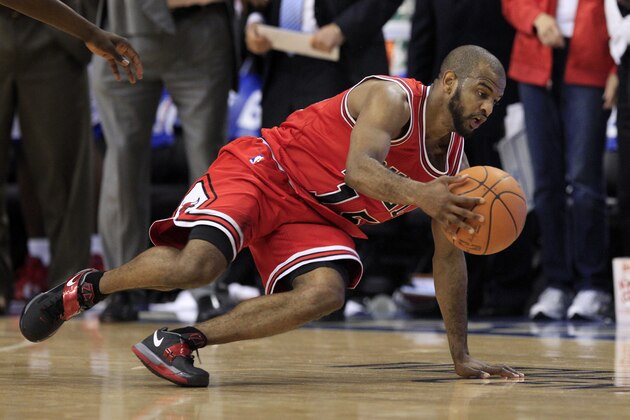 Chicago Bulls' John Lucas III, (15) dribbles the ball as he slips and falls in the fourth quarter of Game 3 in an NBA basketball first-round playoff series against the Philadelphia 76ers, in Philadelphia, Pa., Friday, May 4, 2012. 76ers won 79-74. (AP Photo/Mel Evans)