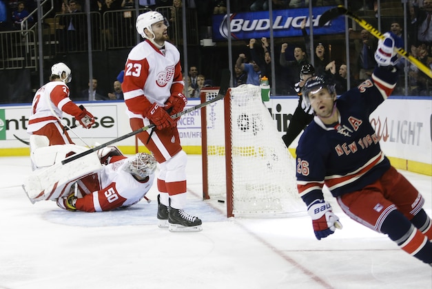 New York Rangers' Martin St. Louis (26) reacts after shooting the puck past Detroit Red Wings goalie Jonas Gustavsson (50), of Sweden, for a goal during the second period of an NHL hockey game Wednesday, Nov. 5, 2014, in New York.  (AP Photo/Frank Franklin II)