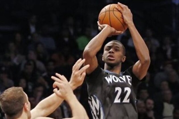 Minnesota Timberwolves guard Andrew Wiggins (22) shoots over Brooklyn Nets forward Bojan Bogdanovic (44) during the first half of an NBA basketball game, Wednesday, Nov. 5, 2014, in New York. (AP Photo/Kathy Willens)