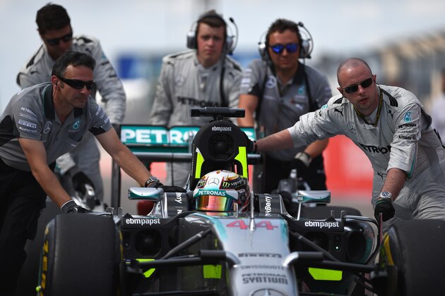 AUSTIN, TX - NOVEMBER 02:  Lewis Hamilton of Great Britain and Mercedes GP's car is pushed onto the grid before the United States Formula One Grand Prix at Circuit of The Americas on November 2, 2014 in Austin, United States.  (Photo by Paul Gilham/Getty Images)
