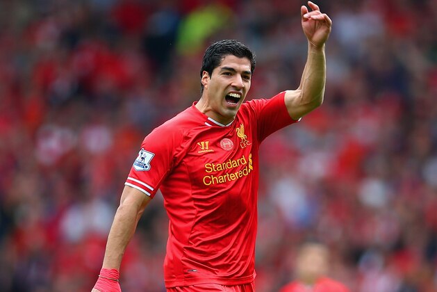 LIVERPOOL, ENGLAND - APRIL 27:  Luis Suarez of Liverpool signals during the Barclays Premier League match between Liverpool and Chelsea at Anfield on April 27, 2014 in Liverpool, England.  (Photo by Clive Brunskill/Getty Images)