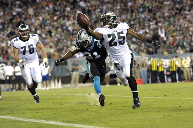 Philadelphia Eagles running back LeSean McCoy, right,  scores a touchdown past Carolina Panthers safety Mike Mitchell during the first half of a preseason NFL football game, Thursday, Aug. 15, 2013, in Philadelphia. (AP Photo/Michael Perez)