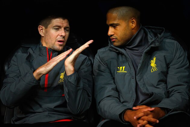 MADRID, SPAIN - NOVEMBER 04:  (L-R) Steven Gerrard. Glen Johnson of Liverpool talk as they sit on substitute the bench during the UEFA Champions League Group B match between Real Madrid CF and Liverpool FC at Estadio Santiago Bernabeu on November 4, 2014 in Madrid, Spain.  (Photo by Gonzalo Arroyo Moreno/Getty Images)