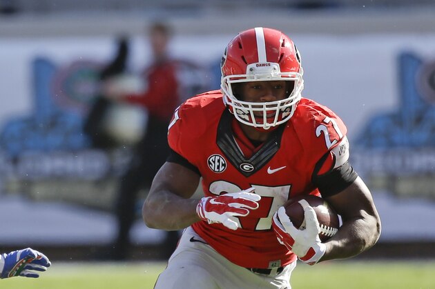 Georgia running back Nick Chubb (27) runs against Florida during the first half of an NCAA college football game in Jacksonville, Fla., Saturday, Nov. 1, 2014. (AP Photo/John Raoux)