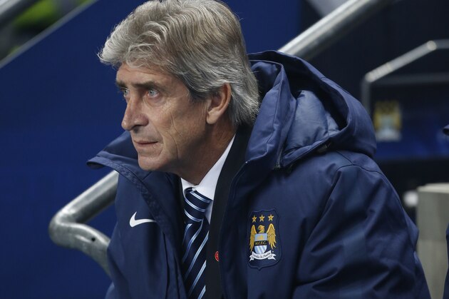 Manchester City's head coach Manuel Pellegrini sits, during the Champions League group E soccer match between Manchester City and CSKA Moscow, at the Etihad Stadium, in Manchester, England, Wednesday, Nov. 5, 2014. (AP Photo/Jon Super)