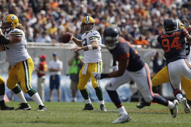 Green Bay Packers quarterback Aaron Rodgers (12) prepares to pass against the Chicago Bears in the second half of an NFL football game Sunday, Sept. 28, 2014, in Chicago. (AP Photo/Nam Y. Huh)