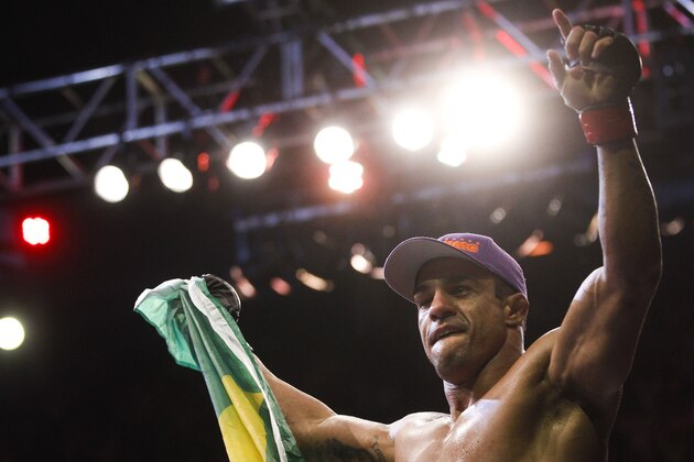 Vitor Belfort, from Brazil, celebrates after defeating Antony Johnson, from the US, during their middleweight mixed martial arts bout at the Ultimate Fighting Championship (UFC) 142 in Rio de Janeiro, Brazil, Sunday, Jan.  15, 2012. (AP Photo/Felipe Dana)