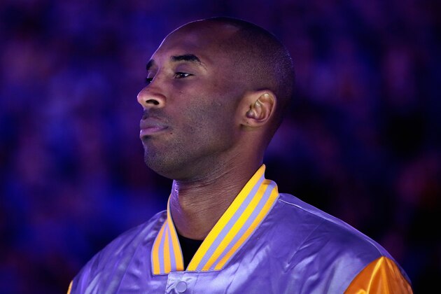 OAKLAND, CA - NOVEMBER 01:  Kobe Bryant #24 of the Los Angeles Lakers stands for the National Anthem before their game against the Golden State Warriors at ORACLE Arena on November 1, 2014 in Oakland, California. NOTE TO USER: User expressly acknowledges and agrees that, by downloading and or using this photograph, User is consenting to the terms and conditions of the Getty Images License Agreement.  (Photo by Ezra Shaw/Getty Images)