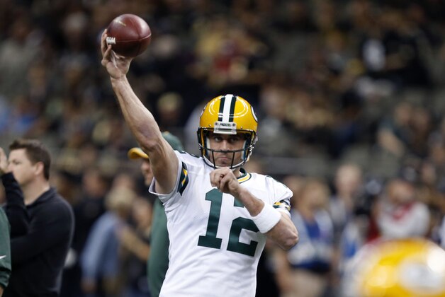 Green Bay Packers quarterback Aaron Rodgers (12) warms up before an NFL football game against the New Orleans Saints in New Orleans, Sunday, Oct. 26, 2014. (AP Photo/Rogelio Solis)
