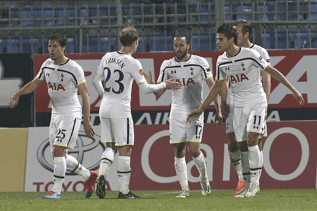 Tottenham Hotspur's  Andros Townsend, center, is congratulated by his teammates after scoring a penalty during the Europa League group C soccer match between Asteras Tripolis and Tottenham at the Theodoros Kolokotronis stadium stadium in Tripolis, Greece, Thursday, Nov. 6, 2014. (AP Photo/Petros Giannakouris)