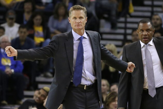 Golden State Warriors coach Steve Kerr, left, gestures from the sideline beside assistant coach Alvin Gentry during the first half of a preseason NBA basketball game against the Los Angeles Clippers on Tuesday, Oct. 21, 2014, in Oakland, Calif. (AP Photo/Ben Margot)