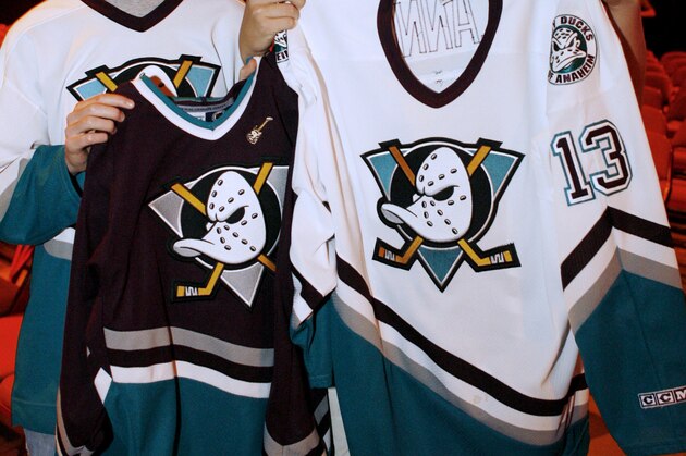 Mighty Ducks of Anaheim fans Jonathan Stapleton, left, and David Flickinger, both 17, hold to their team's former uniforms as the attend the unveling ceremony of the club's new logo and jerseys Thursday, June 22, 2006, at the Arrowhead Pond, in Anaheim, Calif. At the same time, the National Hockey League club officially changed its name from the Mighty Ducks of Anaheim, to the Anaheim Ducks. (AP Photo/Damian Dovarganes)