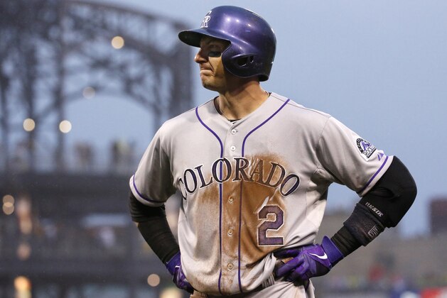 Colorado Rockies shortstop Troy Tulowitzki (2) grimaces as he walks back to the dugout after grounding out to end the fourth inning of a baseball game against the Pittsburgh Pirates in Pittsburgh Saturday, July 19, 2014. Tulowitzki left the game.(AP Photo/Gene J. Puskar)