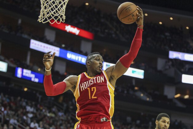 Nov 6, 2014; Houston, TX, USA; Houston Rockets center Dwight Howard (12) gets a rebound during the second quarter against the San Antonio Spurs at Toyota Center. Mandatory Credit: Troy Taormina-USA TODAY Sports