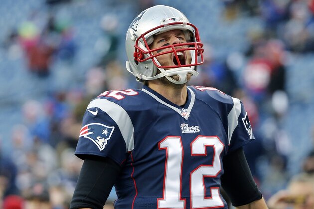 New England Patriots quarterback Tom Brady (12) shouts as he takes the field at Gillette Stadium before an NFL football game against the Denver Broncos on Sunday, Nov. 2, 2014, in Foxborough, Mass. (AP Photo/Elise Amendola)