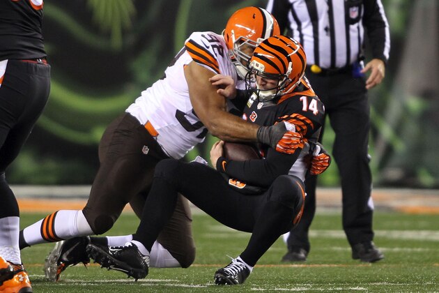 CINCINNATI, OH - NOVEMBER 6:  Desmond Bryant #92 of the Cleveland Browns sacks Andy Dalton #14 of the Cincinnati Bengals during the third quarter at Paul Brown Stadium on November 6, 2014 in Cincinnati, Ohio. (Photo by John Grieshop/Getty Images)