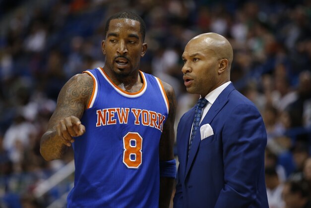 Oct 8, 2014; Hartford, CT, USA; New York Knicks head coach Derek Fisher (right) talks with guard J.R. Smith (8) during a break in the action against the Boston Celtics in the second half at XL Center. The Celtics defeated the New York Knicks 106-86. Mandatory Credit: David Butler II-USA TODAY Sports